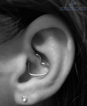 daith-ear-piercing-and-lobe-piercing-with-heart-ring-and-studs.jpg