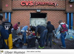 Protestors helping clean up the CVS which was burned by Looters.