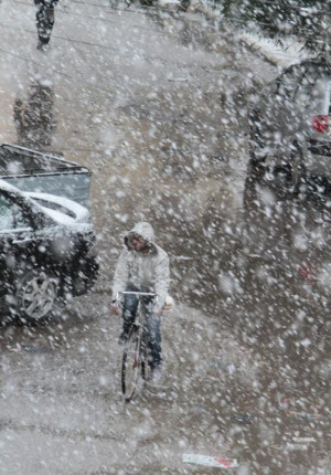 in during snow fall in Damascus on January 9, 2013 as a fierce storm ...