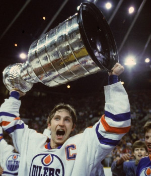 Wayne Gretzky of the Edmonton Oilers hoisting the Stanley Cup in 1984