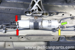 Late fuel filter assembly: This filter has three fuel lines connected ...