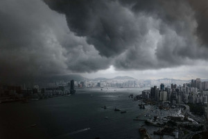 Clouds build up over the Victoria harbour before a storm in Hong Kong ...