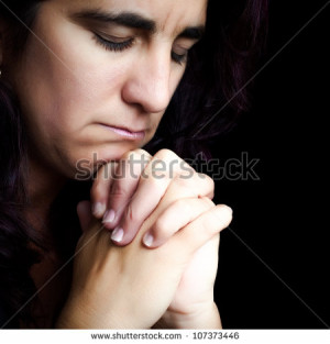 Hispanic Woman Praying With...