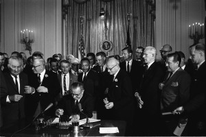 President Lyndon Johnson signs the Civil Rights Act of 1964 into law ...