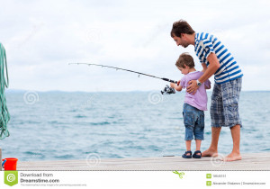 Young father and his son fishing together from wooden jetty.