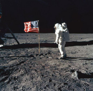 ... Armstrong, clad in a white space suit, climb down the lunar module's