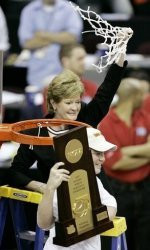 coach Pat Summitt holds the basketball net and her son Tyler Summitt ...