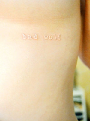simple quote white ink tattoo - bad wolf