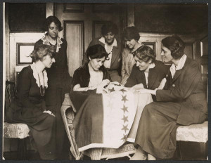 Alice Paul sews a star on to a 