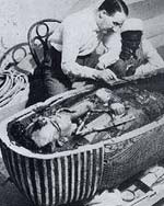 Carter examining the mummy of Tutankhamen