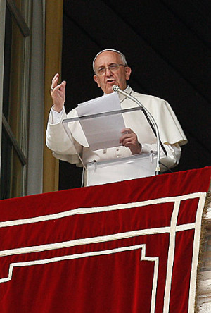 Pope Francis speaks as he leads the Angelus from the window of his ...