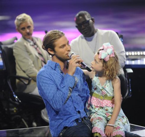 ... up a little girl and wound up singing behind the judges table. Who was