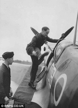 Hero: Douglas Bader hoists one of his artificial legs into the cockpit ...