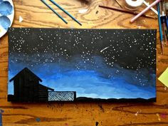 ... starry night sky scene, including a barn silhouette & a shooting star