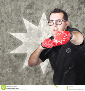 Regular guy punching and working up a sweat with boxing gloves on ...