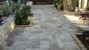 River rock and planters added to Lafitt Patio Slab in Danville Beige