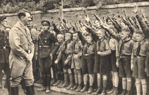 Members of the Hitler Youth salute Hitler, 1933.