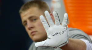 Watt #99 of the Houston Texans of the displays a glove to ...