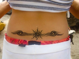 it seems that this girl has a tribal tattoo and it has adorned or ...