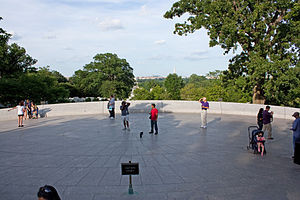 ... plaza near the grave site with walls inscribed with Kennedy quotes