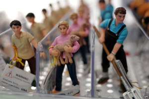 Toy farm workers are displayed at the London Toy Fair in Olympia ...