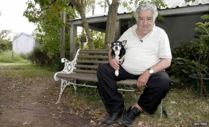 Uruguay's President Jose Mujica sits with his dog at his farm in the ...