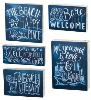 Beach chalk signs with sayings.