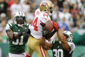 San Francisco 49ers wide receiver Randy Moss loses control of the ball ...