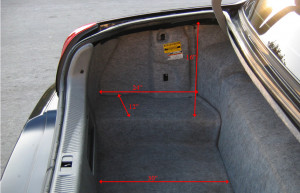 Lincoln Town Car - trunk measures 21 cubic feet , pictured below.