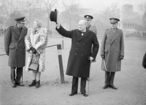 Winston Churchill raises his hat in salute during an inspection of the ...