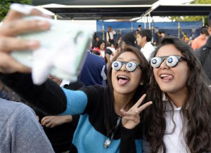 ... people wearing googly eye glasses at a Halloween party in Los Angeles
