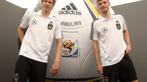 ... in front of an oversized model of the official world cup ball Jabulani