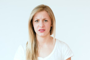 stock-footage-girl-looks-grossed-out-or-disgusted-makes-funny-faces