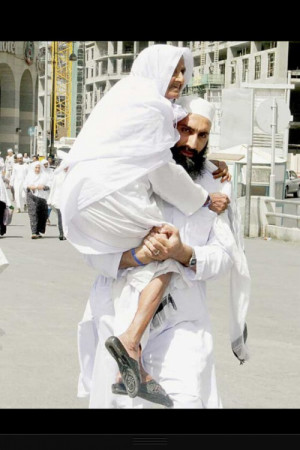 Son Carrying Mother to Friday Prayers (Madinah, Saudi Arabia)