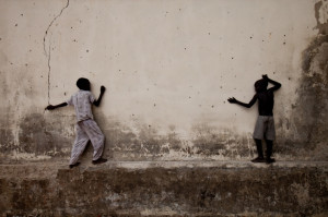 pitted wall of a decaying school on 1 May 2010, the day after a mutiny ...
