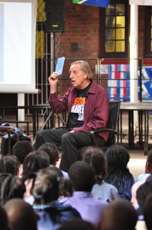 Ariel Dorfman reads to children as part of his Mandela Day activities