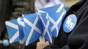 pro-independence supporter holds campaign material during a rally by ...