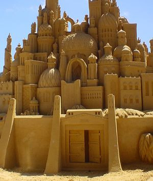 sand castle is a type of sand sculpture which resembles a miniature ...