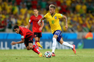 Neymar skipping past a defender in Brazil vs Mexico for the FIFA World