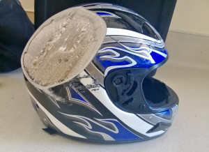 This motorcycle helmet (and it's user) hit a bus at 70 MPH.....112.65 ...
