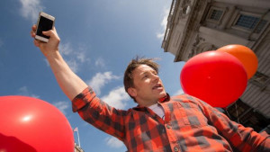 British chef and television presenter Jamie Oliver carries out a ...