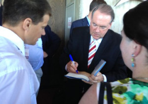 Mike Huckabee signs at book at the Family Leadership Summit in Ames on ...