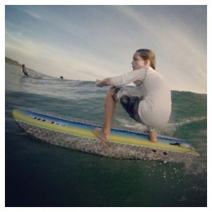 Using her bare feet to balance on her surfboard, Kate Hudson enjoys an ...