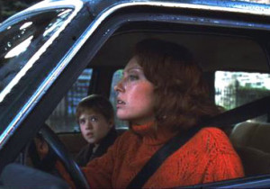 ... driving her old beat up car on the highway with her 7 year old old son