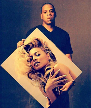 Hands-on ... Jay-Z poses with picture of his wife Beyonce