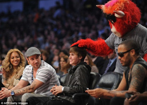 Celebrity guests: Beyonce Knowles (left) giggled as Chicago Bulls ...