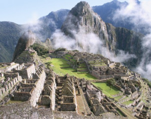 The classic view of Machu Picchu with mist swirling up from the ...