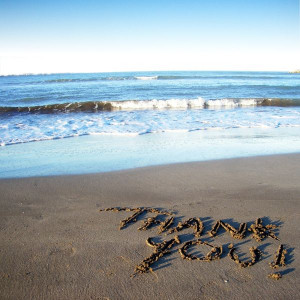 giving thanks thank you spelled out on beach blue ocean water waves ...