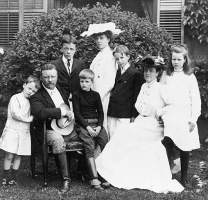 President and Mrs. Theodore Roosevelt seated on lawn, surrounded by ...