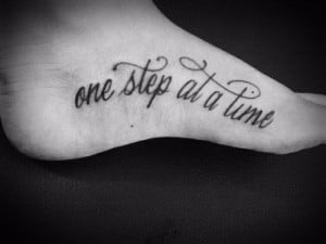 See more One step at a time quote tattoos on side foot